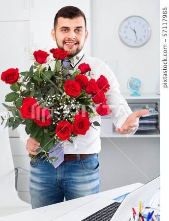 Young man ready to present flowers to woman Young man ready to present flowers to woman 57117988
