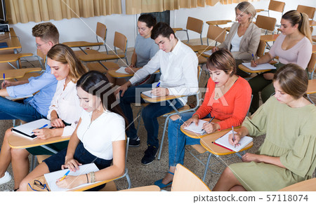 Group of people in lecture hall Group of people in lecture hall 57118074