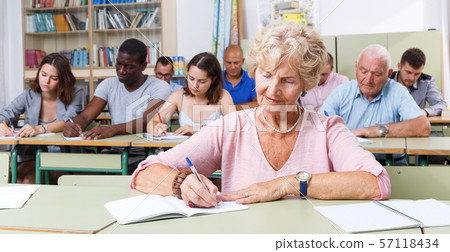 Mature woman take a written exam Mature woman take a written exam 57118434