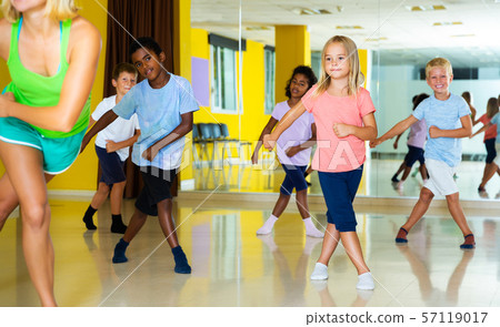 Children dancing choreography with female coach 57119017