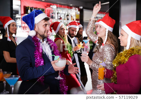 Man with females on corporate new year party in bar 57119029