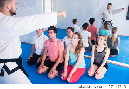 Karate coach teaching adults 57119243