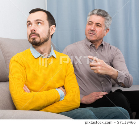 Adult father and son solve problems Adult father and son solve problems 57119466