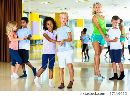 Children dancing together slow ballroom dances in pairs in chore Children dancing together slow ballroom dances in pairs in chore 57119613