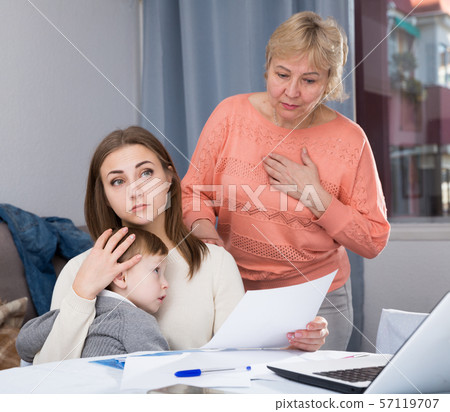 Woman is outraged of utility bills and quarreling with her mother 57119707