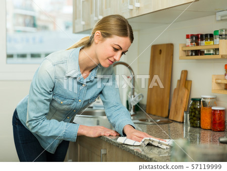 Housewife cleaning kitchen surfaces 57119999