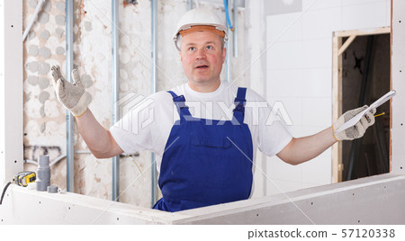 Happy male contractor Happy male contractor 57120338