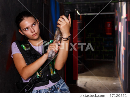 woman with laser guns took aim and posing during laser tag game 57120851