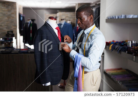 Portrait of afro-american man customer choosing business style tie in the shop Portrait of afro-american man customer choosing business style tie in the shop 57120973
