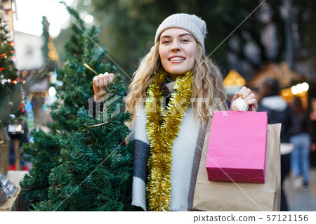 Woman buying Christmas tree Woman buying Christmas tree 57121156
