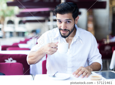 Man spending time in cafe outdoors Man spending time in cafe outdoors 57121461