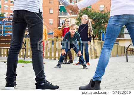 Junior school girls and boys playing octopus tag 57122069
