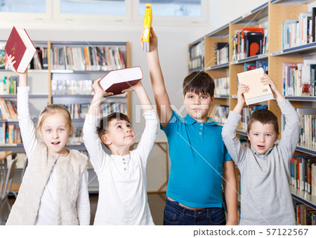 Happy children in school library Happy children in school library 57122567