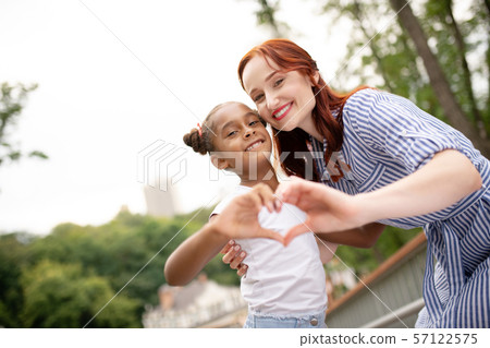 Daughter and mommy feeling truly contended together 57122575