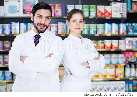 man and girl pharmacists in apothecary. man and girl pharmacists in apothecary. 57122733