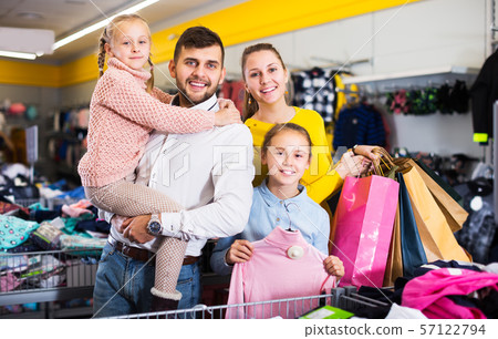 Family after shopping in store Family after shopping in store 57122794