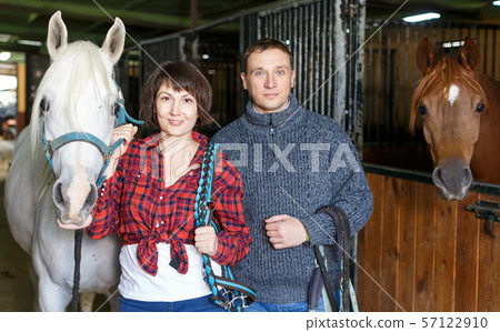 Portrait of man and woman with roan horse Portrait of man and woman with roan horse 57122910