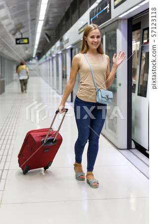 Woman entering subway car Woman entering subway car 57123118