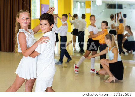 Little boys and girls having dancing class in classroom 57123595
