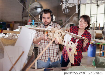 Female and male creating plane models 57123876