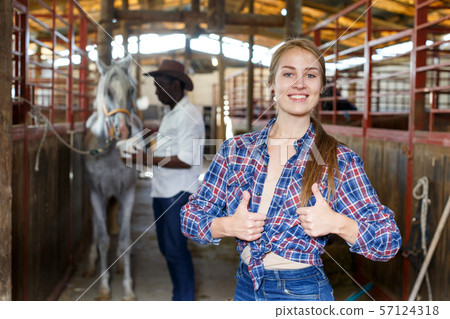 Portrait of girl at horse stable Portrait of girl at horse stable 57124318