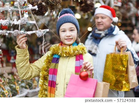 Girl looking for Christmas decorations 57124388