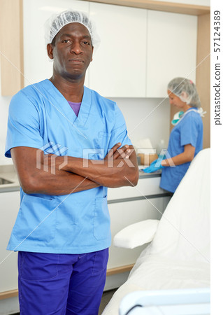 Cosmetician man before procedure in clinic of esthetic cosmetology Cosmetician man before procedure in clinic of esthetic cosmetology 57124389