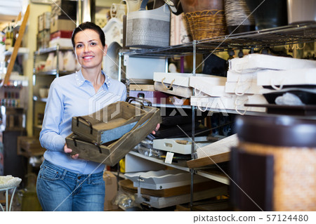 Woman standing with wooden box Woman standing with wooden box 57124480