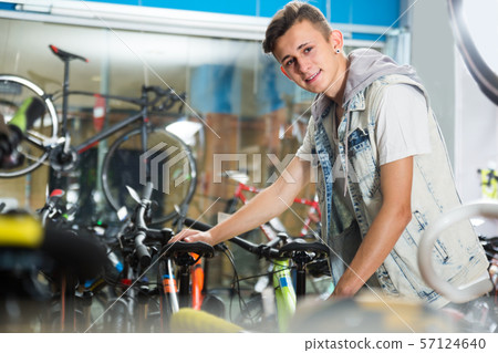 boy choosing new bicycle 57124640