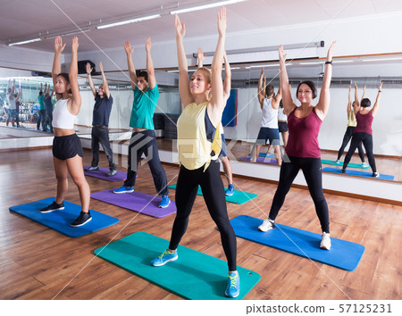 People relaxing and enjoying yoga 57125231