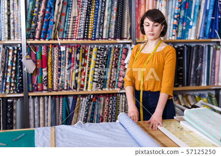Female owner of fabric store Female owner of fabric store 57125250