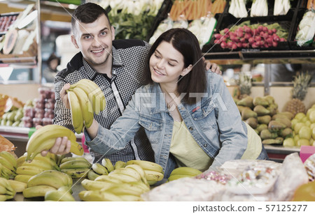 Couple choosing fruit Couple choosing fruit 57125277