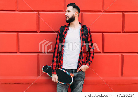 guy with a beard on a background of a brick empty 57126234