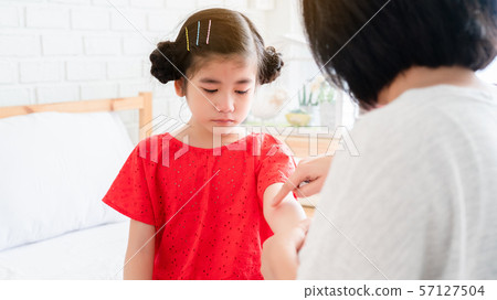 Asian kid girl is sick Received care from mother. Asian kid girl is sick Received care from mother. 57127504