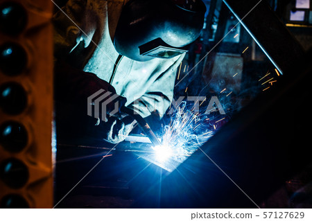 Welder working in factory 57127629