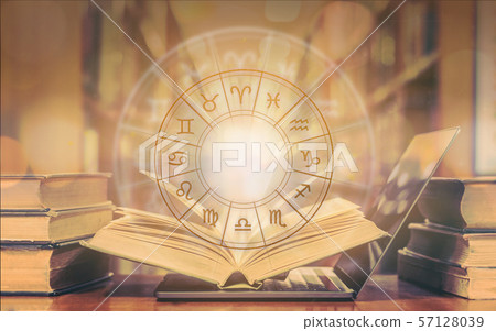 Zodiac sign horoscope astrology and constellation study for foretell and fortune telling education course concept with horoscopic wheel over old book and computer laptop in school library Zodiac sign horoscope astrology and constellation study for foretell and fortune telling education course concept with horoscopic wheel over old book and computer laptop in school library 57128039