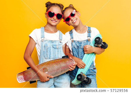 Two teenagers, stylish children posing with 57129556