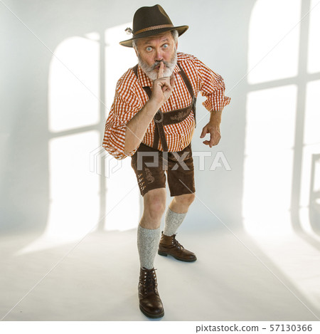 Portrait of Oktoberfest man, wearing the traditional Bavarian clothes Portrait of Oktoberfest man, wearing the traditional Bavarian clothes 57130366