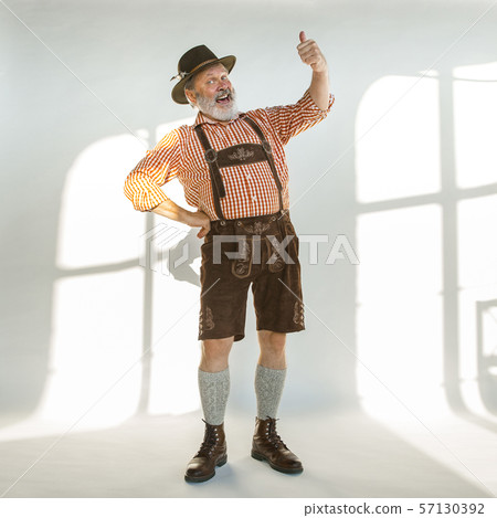 Portrait of Oktoberfest man, wearing the traditional Bavarian clothes Portrait of Oktoberfest man, wearing the traditional Bavarian clothes 57130392