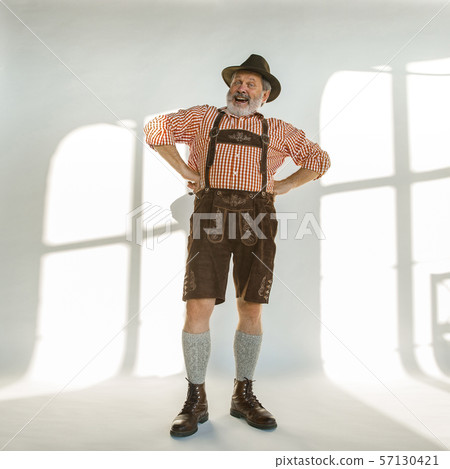 Portrait of Oktoberfest man, wearing the traditional Bavarian clothes Portrait of Oktoberfest man, wearing the traditional Bavarian clothes 57130421