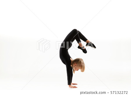 Female little gymnast practicing isolated on white background 57132272