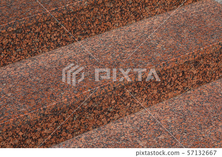 Close-up of dark red granite tile staircase in daylight 57132667