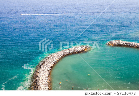 People swimming in a small lagoon 57136478
