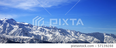 Sunlight snow mountains and blue sky with clouds Sunlight snow mountains and blue sky with clouds 57139288
