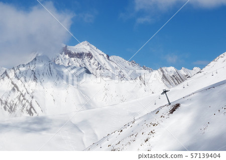 Off-piste slope and chair-lift on ski resort at Off-piste slope and chair-lift on ski resort at 57139404