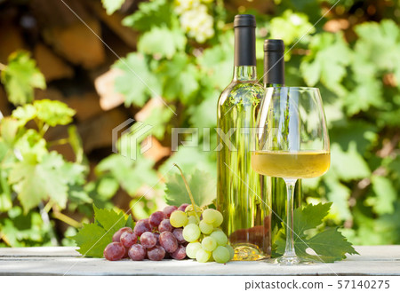 Colorful grapes and white wine Colorful grapes and white wine 57140275