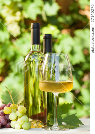 Colorful grapes and white wine Colorful grapes and white wine 57140276