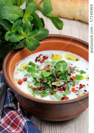 Refreshing summer soup, the rice, mint and yoghurt, spices. Refreshing summer soup, the rice, mint and yoghurt, spices. 57140969
