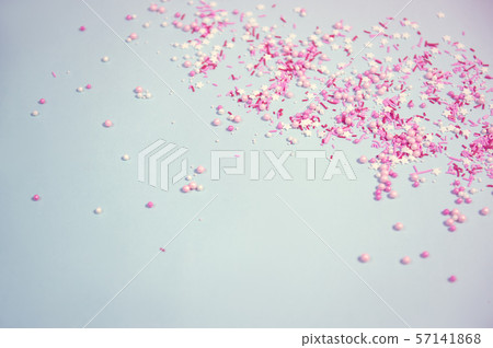 Colorful sprinkles on blue background, top view with copy space 57141868