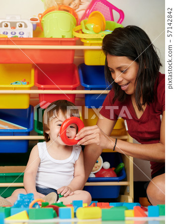 Babysitter have fun with baby Babysitter have fun with baby 57142842